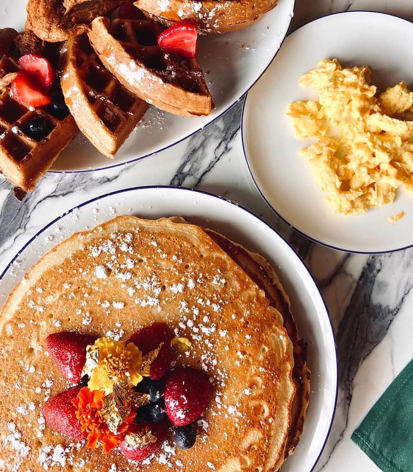 Pancakes, waffles, eggs and strawberries at Breakfast at Barneys