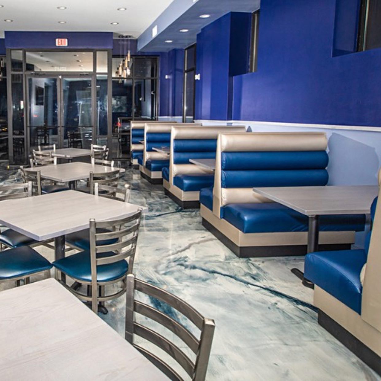 Interior shot of blue and silver themed restaurant at Nouveau Bar and Grill