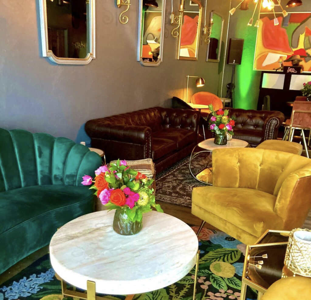 Flowers, mirrors, rugs and colorful chairs at The Social House