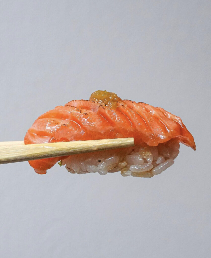 Sushi on chopsticks at Moko